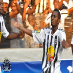 Mazembe's Deo Kanda celebrates with fans after scoring against Al Ahly