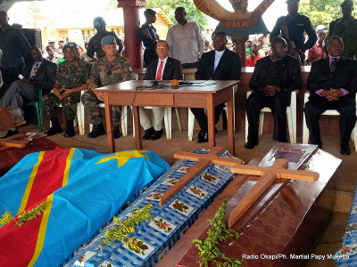 Officials attend a ceremony in honor of victims of the ADF rebels on 10.17.2014