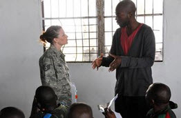 Air Force Staff Sgt. Amber Weaver, an aeromedical evacuation technician with the Wyoming Air National Guard's 187th Aeromedical Evacuation Squadron, conducts training to members of the Democratic Republic of the Congo?s armed forces (FARDC) quick response force (UMIR), about aircraft capabilities of the C-130 Hercules during MEDLITE 11, May 2, 2011. (U.S. Air Force photo by Tech. Sgt. John Orrell)
