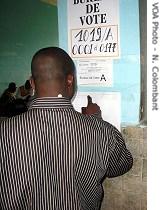 Man looks at preliminary election results