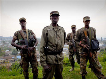 Colonel Sultani Makenga, center, a senior M23 leader, on a hill in eastern Congo, July 2012