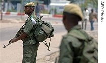 Regular Congolese army soldiers hold a position on a street corner in Kinshasa, 22 Mar 2007