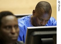 Alleged Congolese warlord Thomas Lubanga, right, is seen at the start of a hearing at the International Criminal Court in The Hague, Netherlands, Thursday, Nov. 9, 2006