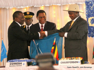 President Yoweri Museveni of Uganda hands over the chairmanship of COMESA to President Joseph Kabila of DR Congo