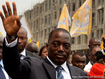 President Joseph Kabila walks with supporters in Kinshasa on September 11, 2011, as he goes to register his candidacy.